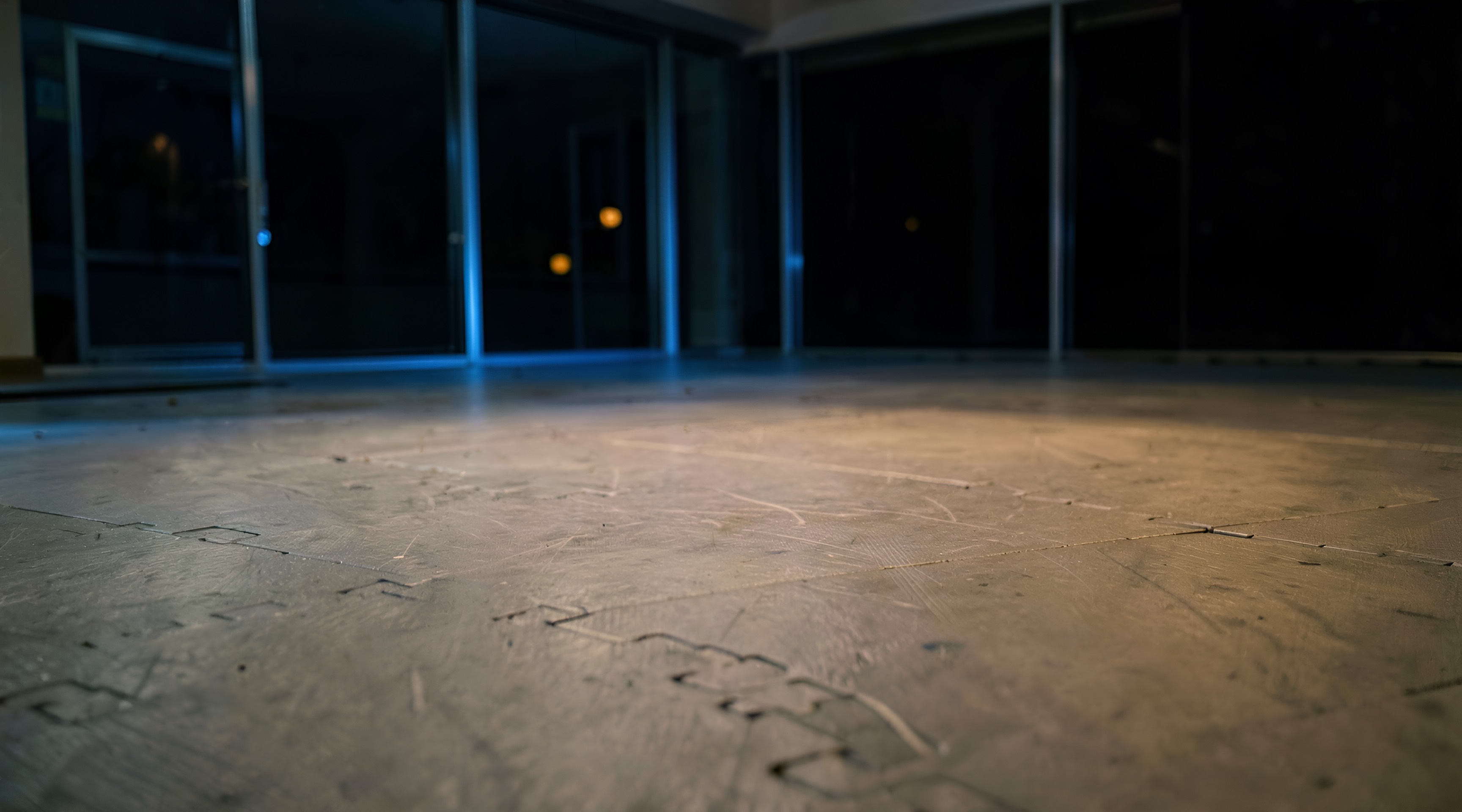 An empty training mat at night, seen from floor level